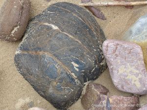 A beach stone made of iron on the Gower Peninsula in South Wales