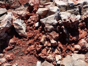 Rock texture in red haematite in Carboniferous limestone at Worm's Head