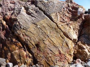 Rock texture and pattern in red haematite in Carboniferous limestone at Worm's Head