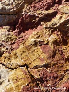 Rock texture and pattern in red haematite in Carboniferous limestone at Worm's Head