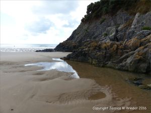 The east side of Three Cliffs bay showing sandy beach and limestone cliffs (context shot)