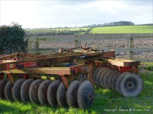 English countryside view with farm machinery