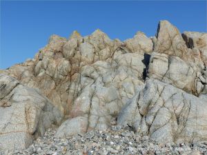 Rock outcrop of L'Eree Granite on the Channel Island of Guernsey with possible 'ghost' xenolith.
