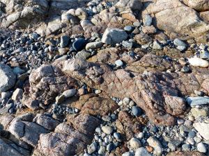 L'Eree Granite on the beach in Guernsey