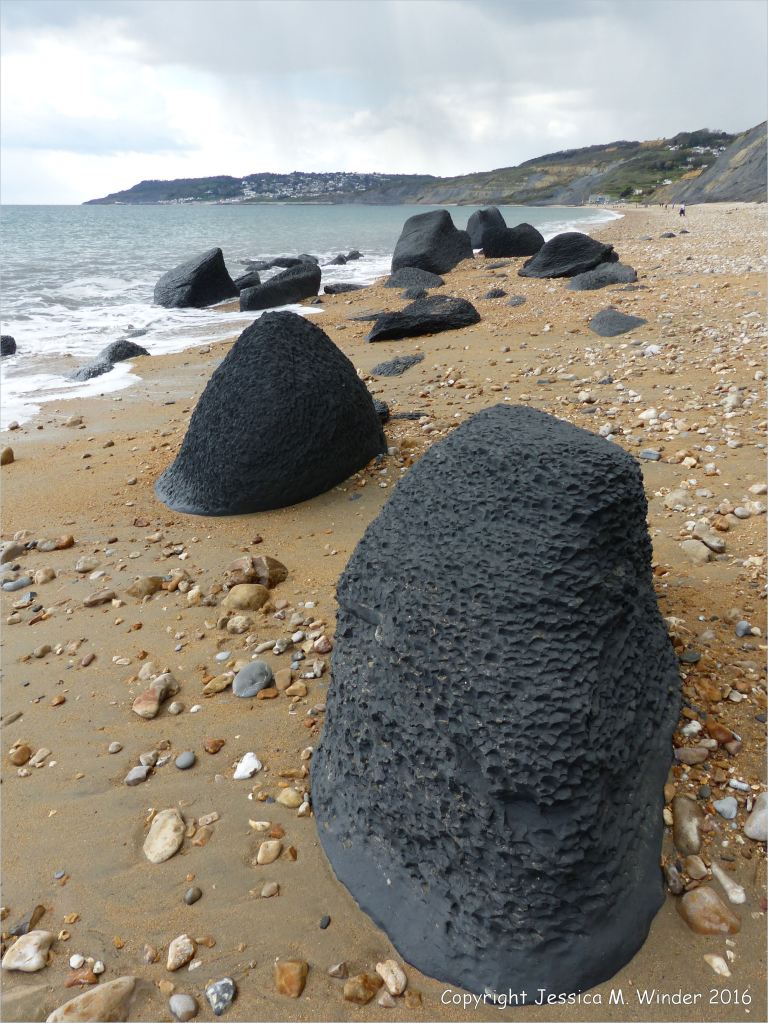 Beach boulders at Charmouth on the World Heritage Jurassic Coast in Dorset, England.