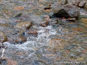 Water texture, colour and pattern in a fast flowing mountain stream
