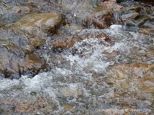 Water texture, colour and pattern in a fast flowing mountain stream