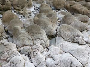 Weathered limestone rock layers on the Worms Head Causeway in Gower, South Wales.