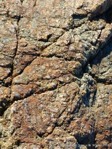 Close-up of rock on the beaach at Rocquaine Bay in Guernsey