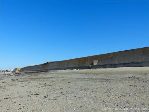 Concrete sea wall in the central part of Rocquaine Bay