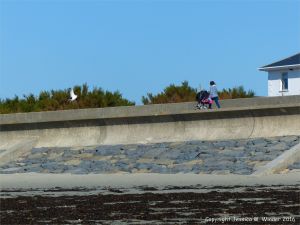 Sea wall of stone and concrete at the northern end of Rocquaine Bay