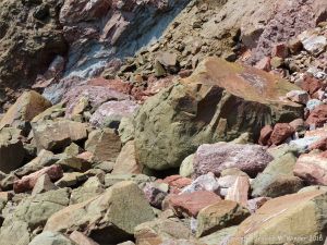 Boulders of basalt, sandstones, and mudstones at the foot of Wasson Bluff