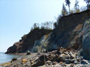 Cliffs and beach boulders at Clarke Head, Nova Scotia, Canada.