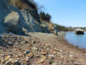 Cliffs and beach boulders at Clarke Head, Nova Scotia, Canada.