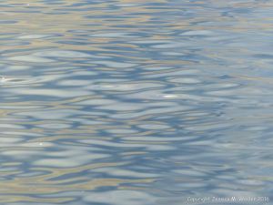 Soft light of evening sun reflected on sea water