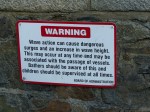 Wave action warning sign at Havelet bay in Guernsey
