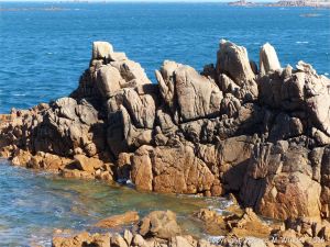 Rocky granite outcrops at Cobo Bay