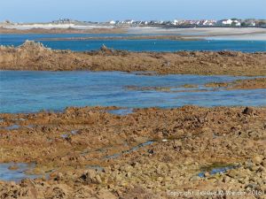 Rocky granite outcrops at Cobo Bay