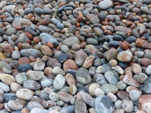 Pebbles at the water's edge at Pleasant Bay in Cape Breton Island