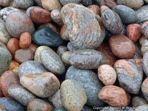 Wet pebbles at the water's edge in Pleasant Bay, Cape Breton Island, NS.