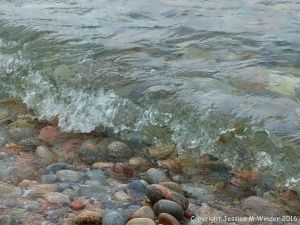 Wet pebbles at the water's edge in Pleasant Bay, Cape Breton Island, NS.