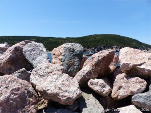 Texture and pattern in Devonian plutonic rocks used as rip-rap at White Point Harbour in Cape Breton Island, Nova Scotia, Canada.