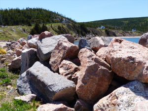Texture and pattern in Devonian plutonic rocks used as rip-rap at White Point Harbour in Cape Breton Island, Nova Scotia, Canada.