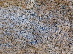 Close-up of texture and pattern in Devonian plutonic rocks used as rip-rap at White Point Harbour in Cape Breton Island, Nova Scotia, Canada.