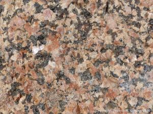 Close-up of texture and pattern in Devonian plutonic rocks used as rip-rap at White Point Harbour in Cape Breton Island, Nova Scotia, Canada.