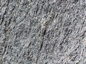 Close-up of texture and pattern in Devonian plutonic rocks used as rip-rap at White Point Harbour in Cape Breton Island, Nova Scotia, Canada.