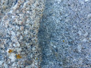 Macro photograph of natural rock pattern and texture in Herm Granodiorite