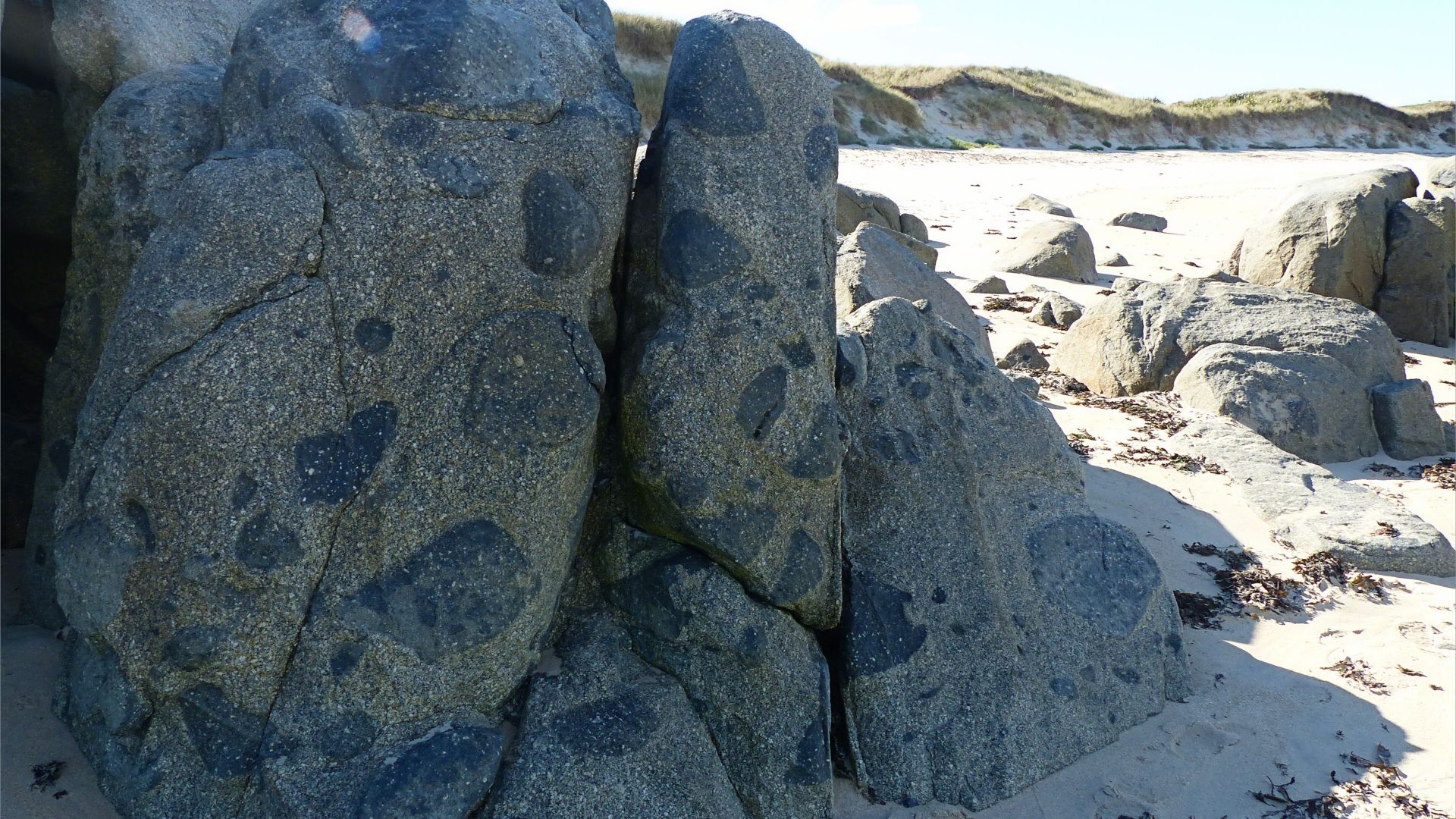 Rocky outcrop of Herm Granodiorite with xenoliths