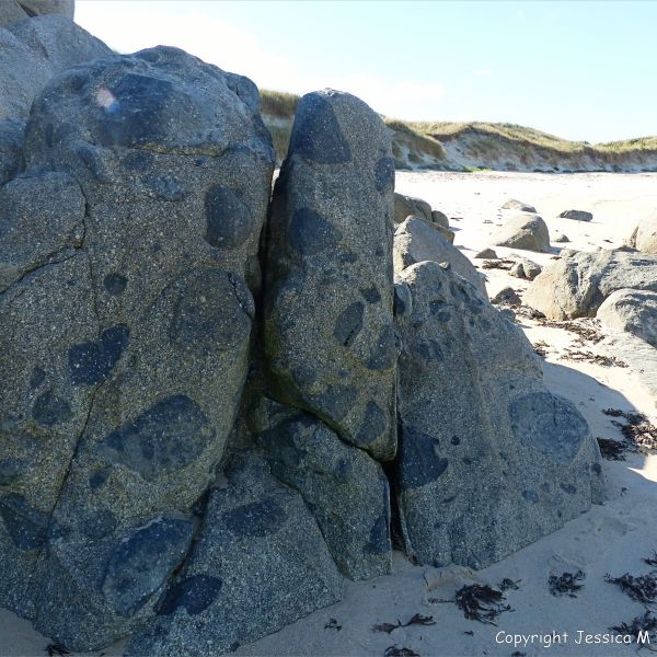 Rocky outcrop of Herm Granodiorite with xenoliths