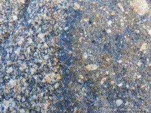 Macro photograph of natural rock pattern and texture in Herm Granodiorite