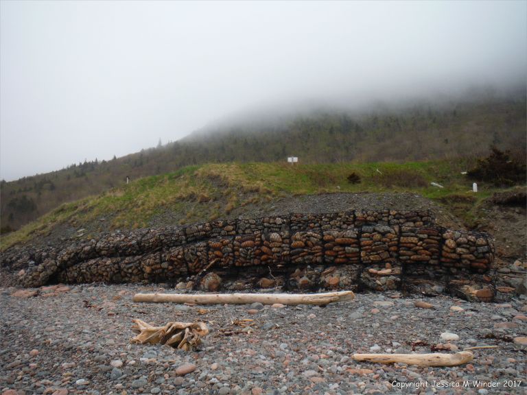 Sea defence gabions filled with beach stones at Corney Brook, Cape Breton Island
