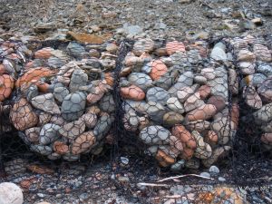 Sea defence gabions filled with beach stones at Corney Brook, Cape Breton Island
