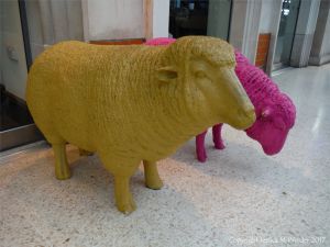 Two colourful sheep on Waterloo Station
