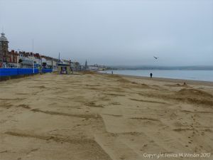 Fresh clean sand newly distributed over Weymouth Beach