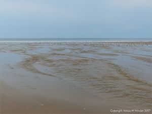 Looking seawards from the outfall of Diles Lake on Rhossili beach