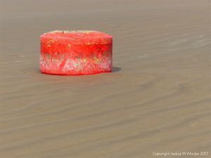Wrecked mooring buoy on the sand at Rhossili