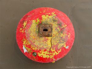Wrecked mooring buoy on the sand at Rhossili