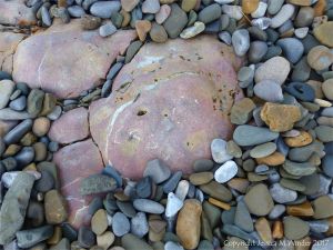 Rocks and pebbles near Twlc Point at Broughton Bay on the Gower Peninsula in South Wales