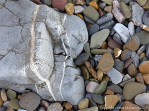 Rocks and pebbles near Twlc Point at Broughton Bay on the Gower Peninsula in South Wales