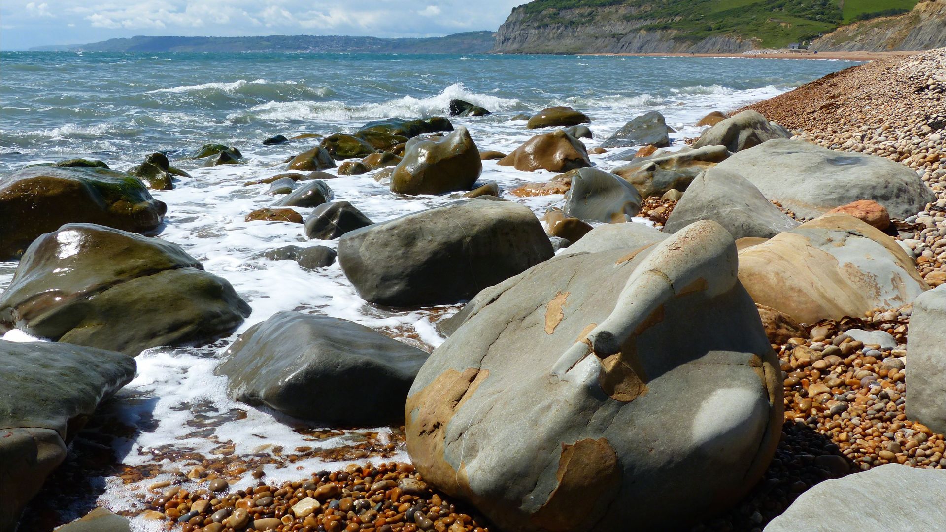 Boulders on the water's edge at Seatown in Dorset
