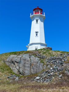 Rocks composed of volcanic ash (tuff) near Louisbourg Lighthouse in cape Breton, Nova Scotia.