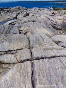 Rocks composed of volcanic ash (tuff) near Louisbourg Lighthouse in cape Breton, Nova Scotia.