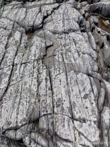 Rocks composed of volcanic ash (tuff) near Louisbourg Lighthouse in cape Breton, Nova Scotia.