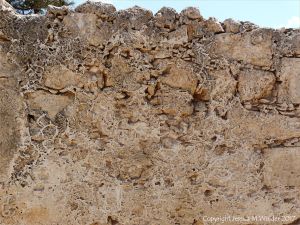 Stone fortress wall with crystal patterns