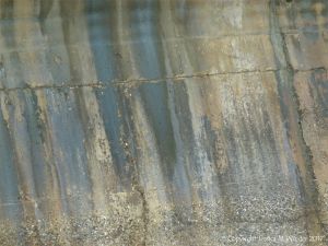 Natural pattern of staining on an old concrete sea wall