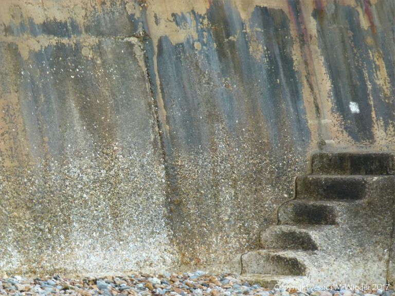 Concrete sea wall and steps for climbing over the breakwaters